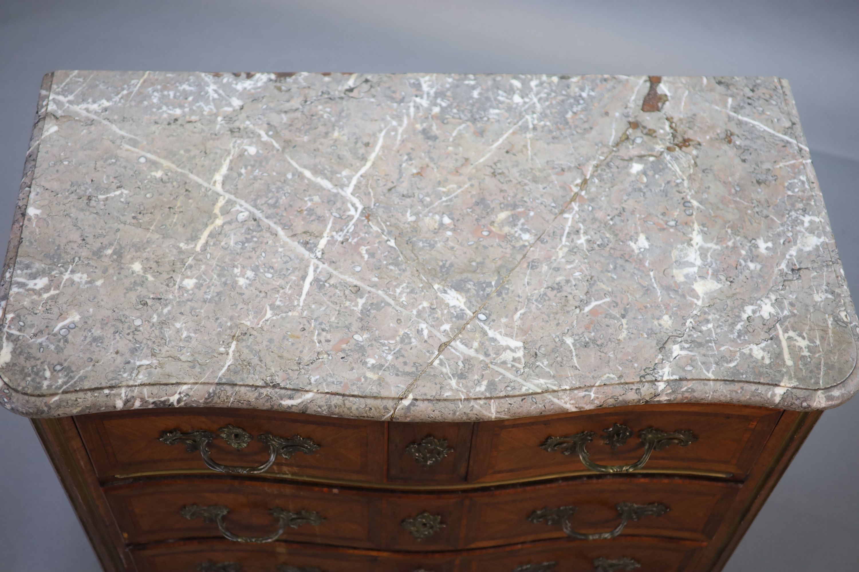 A Louis XVI parquetry serpentine commode, W.113cm D.58cm H.85cm